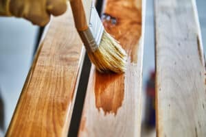 Paint brush staining wood
