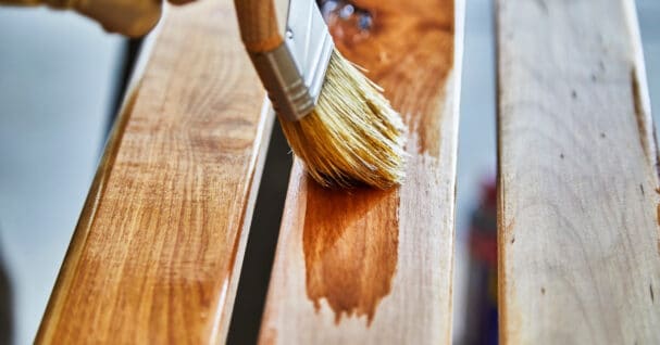 Paint brush staining wood