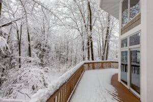 Deck on Home in Snowy Woods in Winter