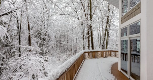 Deck on Home in Snowy Woods in Winter