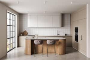 Modern minimalist kitchen interior with curved wooden island, beige cabinetry, and soft natural lighting in contemporary design style.